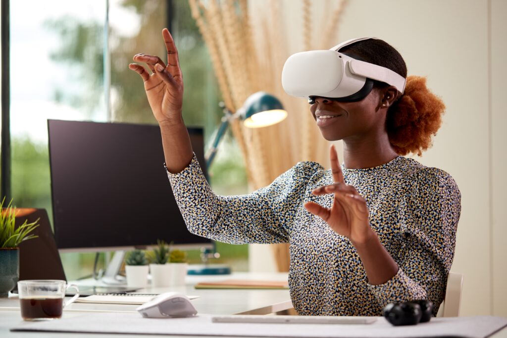 Black woman wearing a VR headset - Black Women In Tech, Madison Ave Magazine