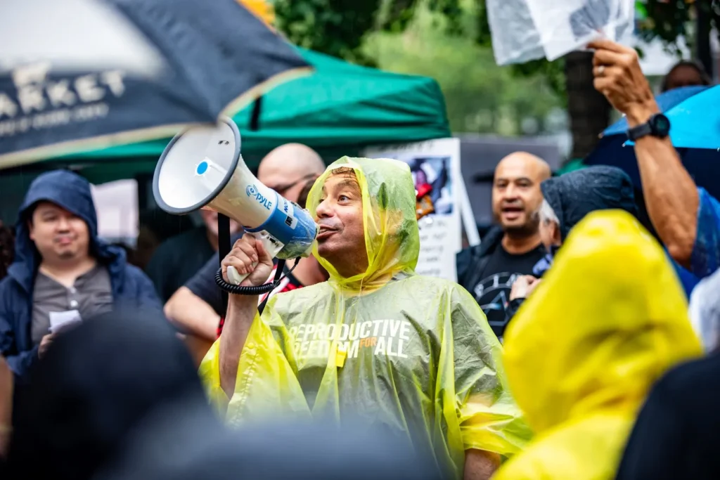 Protestor holds megaphone